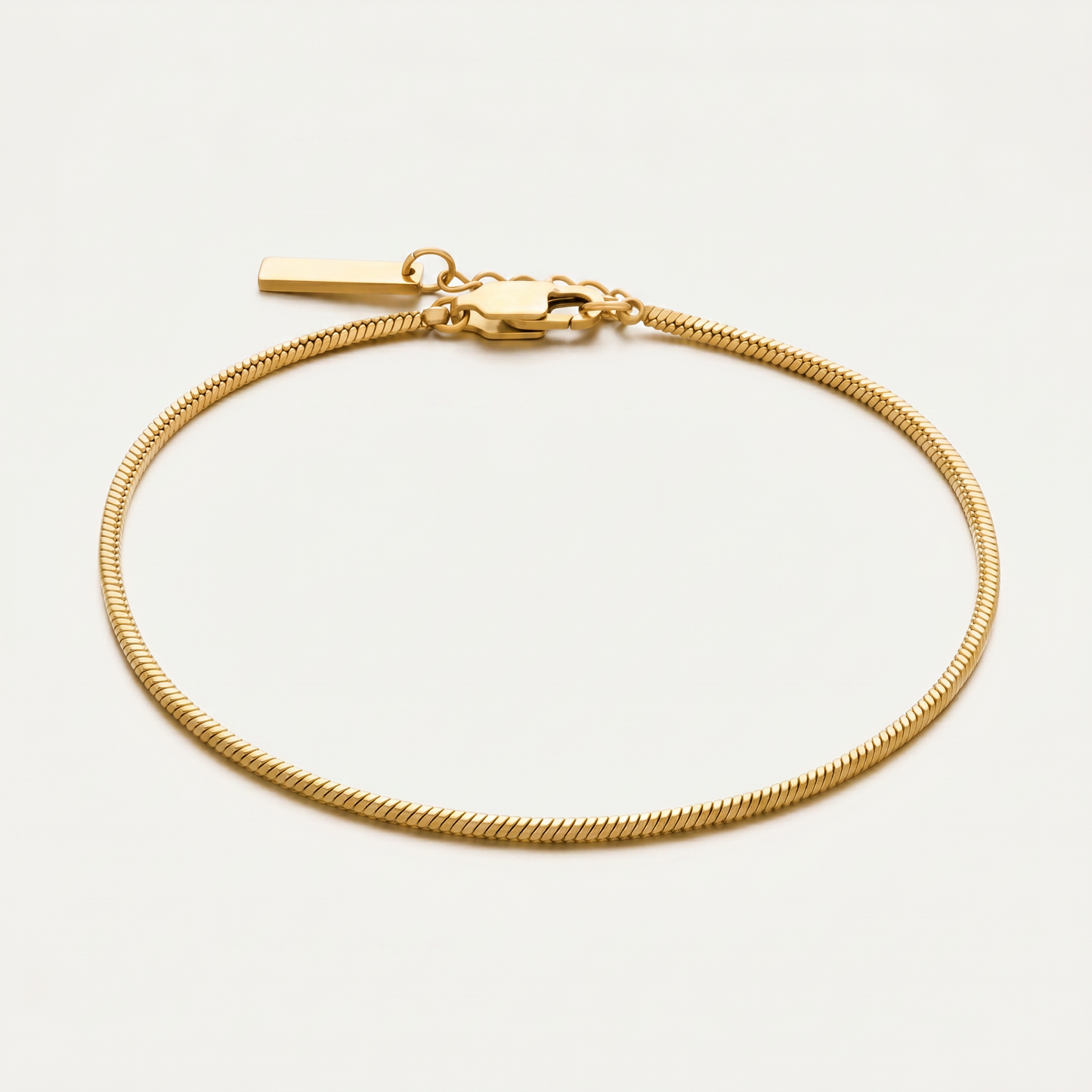 Gold chain bracelet on white