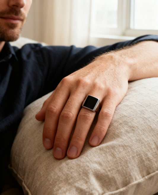 Rectangle onyx signet ring worn on the hand