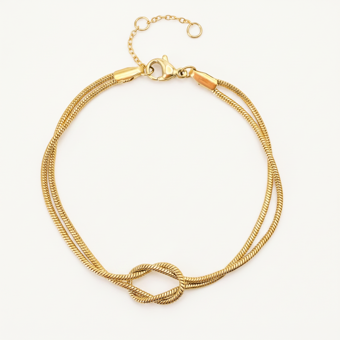 Gold knot bracelet on white
