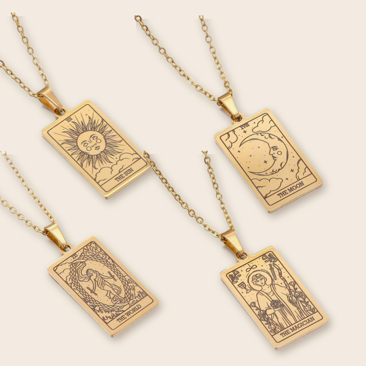 Tarot Necklace Gold, The Sun, The Moon, The World and The Magician together on cream