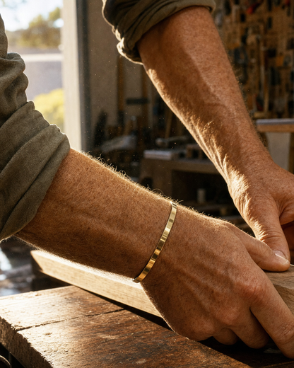 Meridian Cuff Gold worn at a workbench