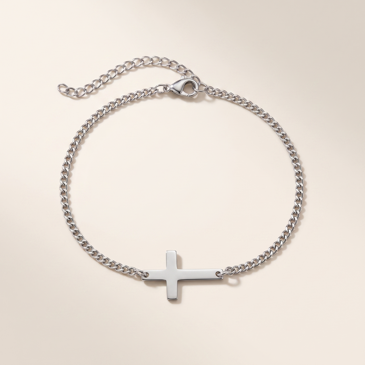 Cross Bracelet in polished stainless steel, studio packshot