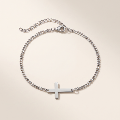 Cross Bracelet in polished stainless steel, studio packshot