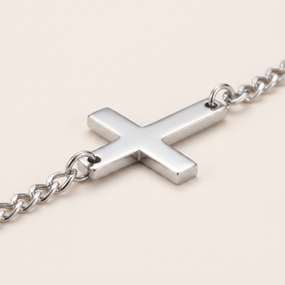 Close up of the cross and curb chain on the Cross Bracelet
