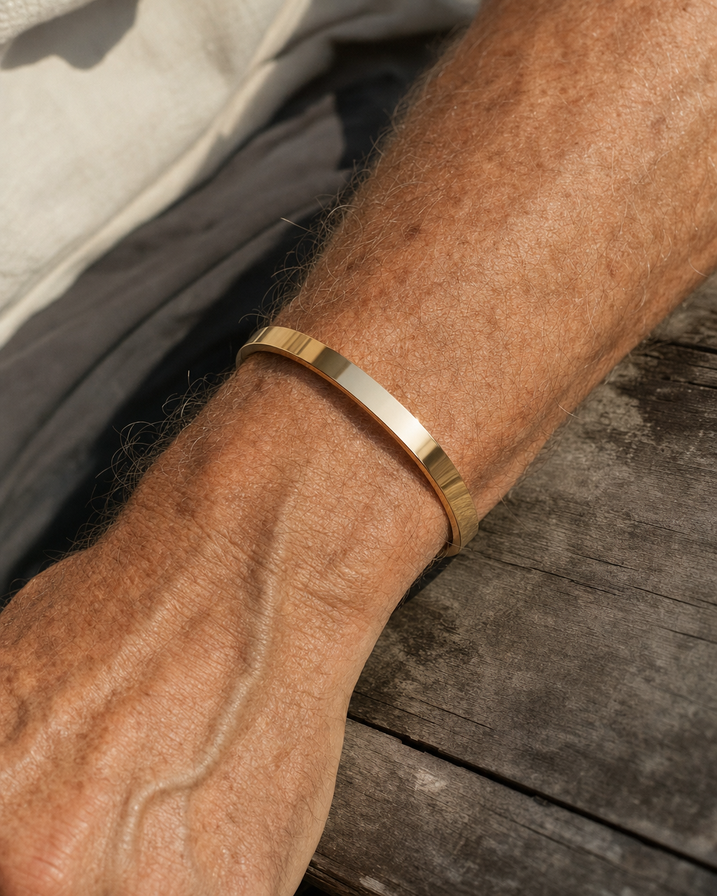 Gold Meridian Cuff worn on the wrist, close up