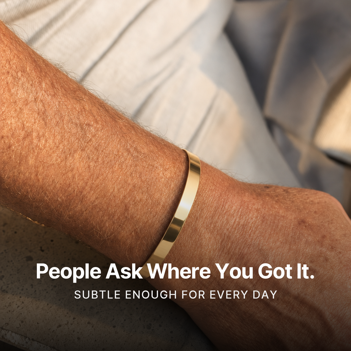 887Seven Meridian Cuff in 18K gold worn on a man's wrist on a concrete ledge. People ask where you got it.