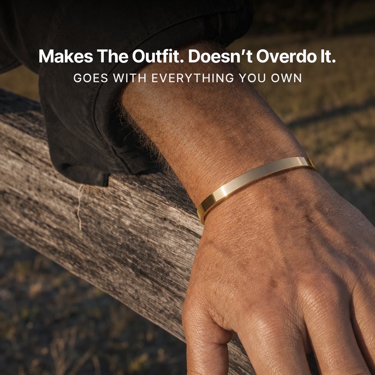 887Seven Meridian Cuff in 18K gold worn outdoors on a fence rail. Makes the outfit, doesn't overdo it.