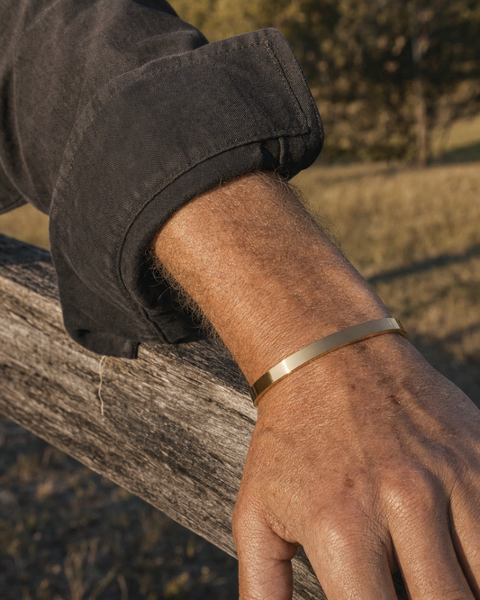 Meridian Cuff Gold worn outdoors in late afternoon light