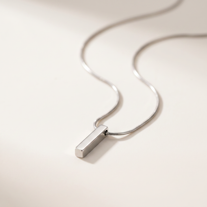 Close-up of the silver bar pendant