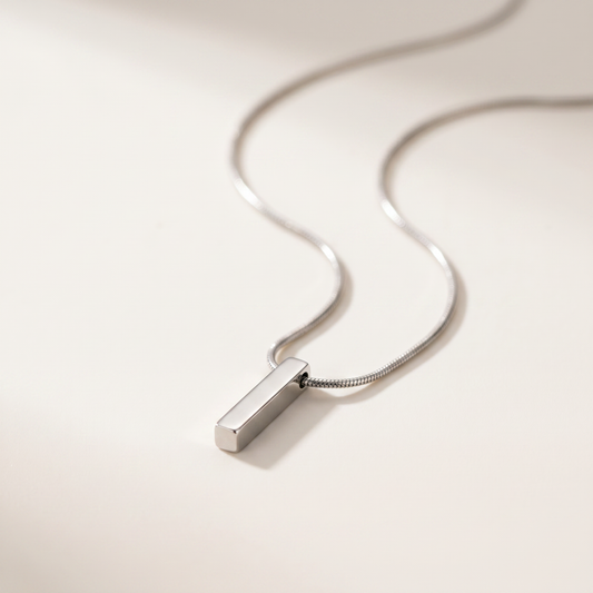 Close-up of the silver bar pendant