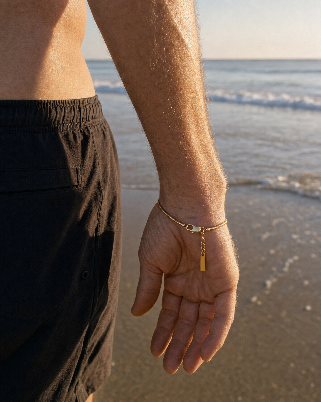 887Seven gold bracelet worn in the water at dawn