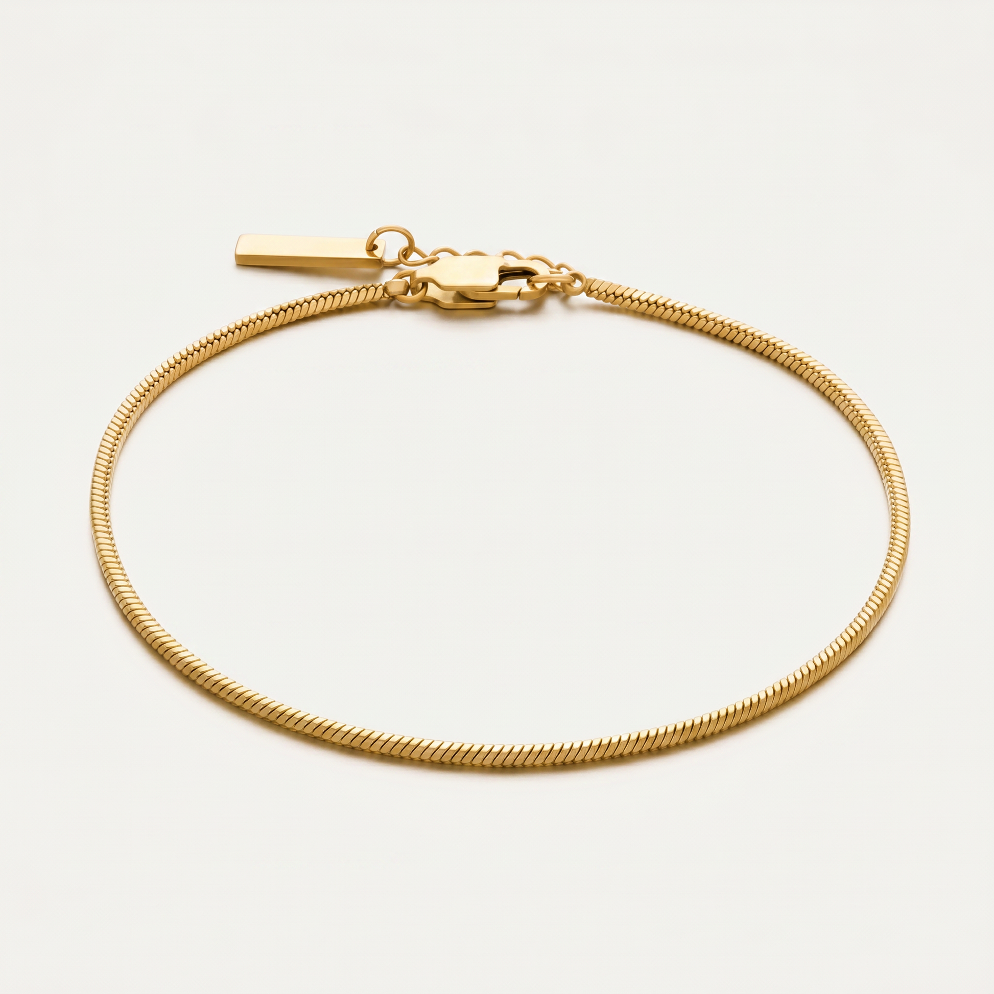Gold chain bracelet on white