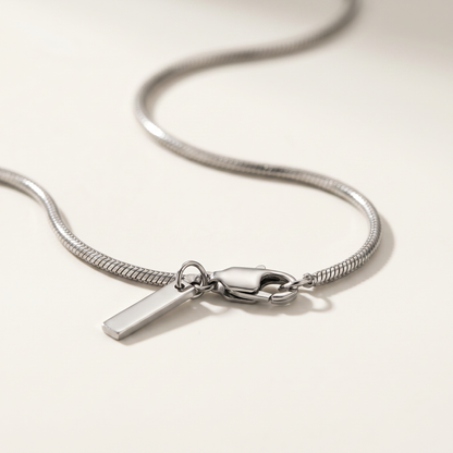 Close-up of the silver chain links and bar tag