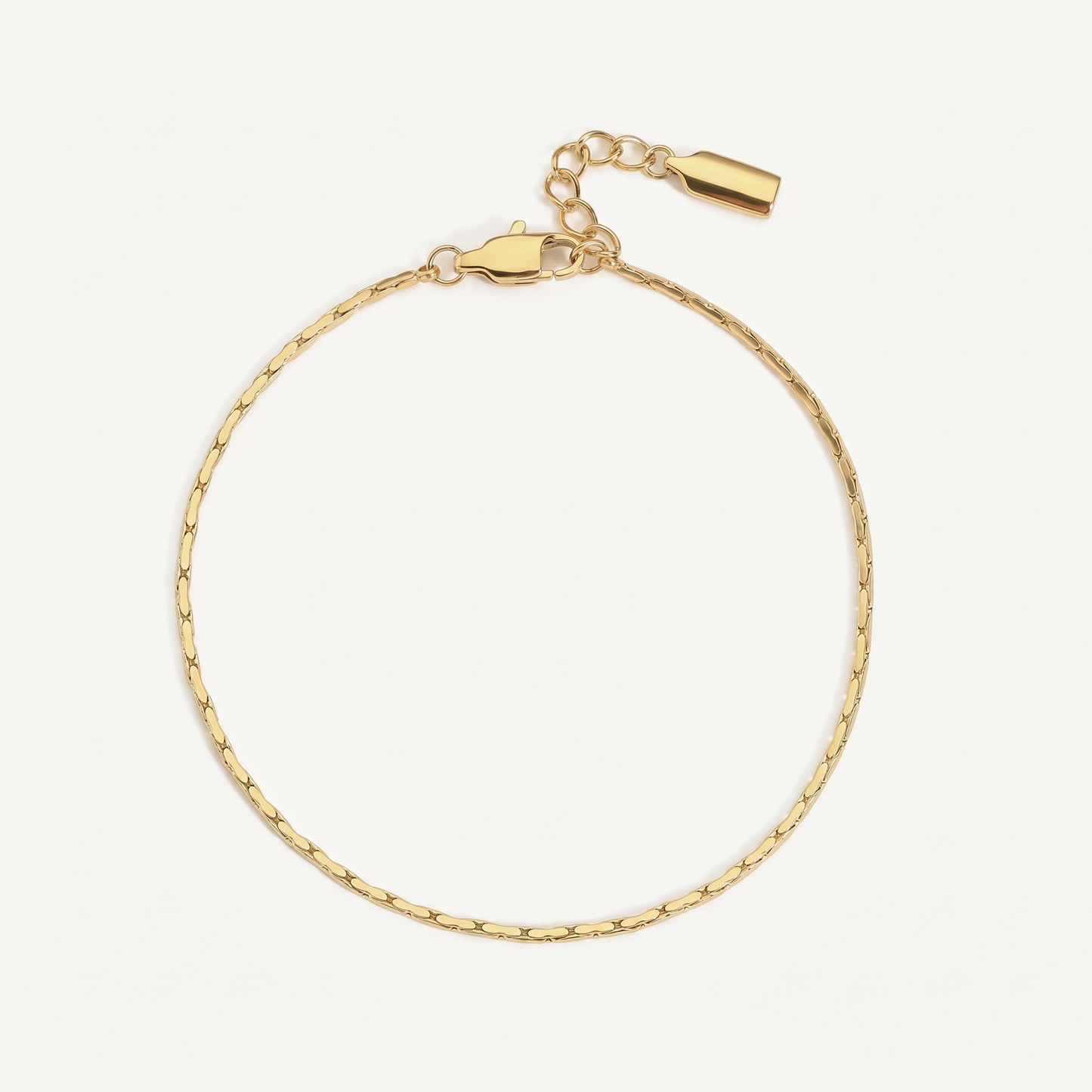Fine gold chain bracelet on white