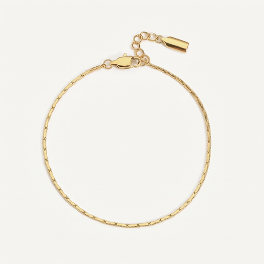 Fine gold chain bracelet on white