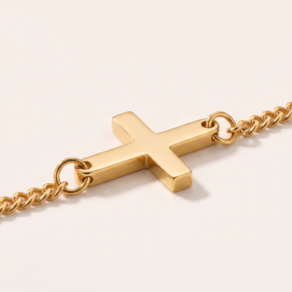 Close up of the cross and curb chain on the Cross Bracelet Gold