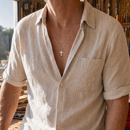 Cross Necklace worn at a workbench