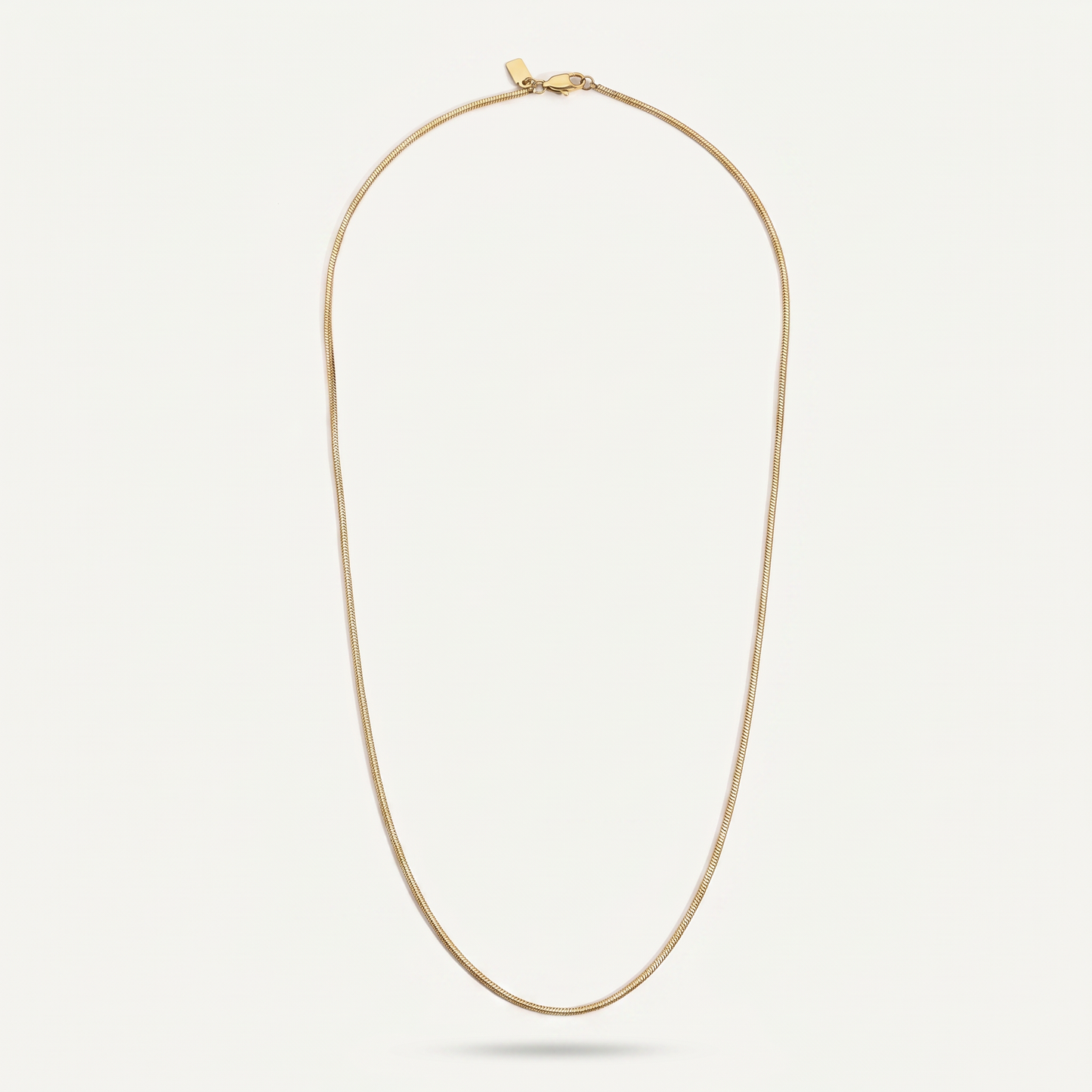 Gold chain necklace on white