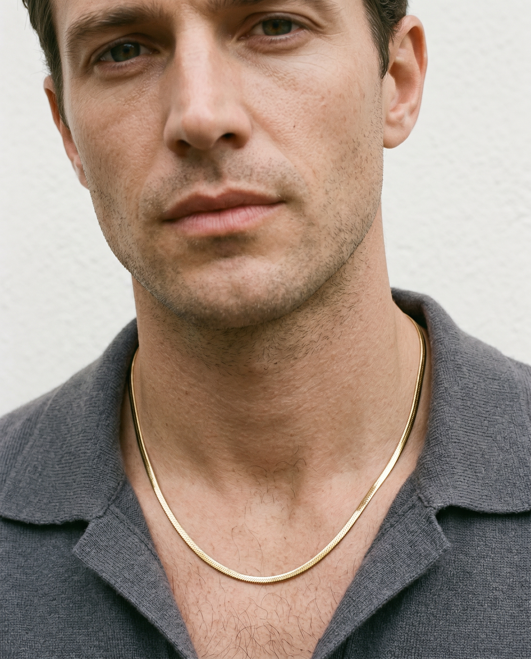 Man wearing the gold chain necklace