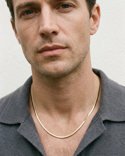 Man wearing the gold chain necklace