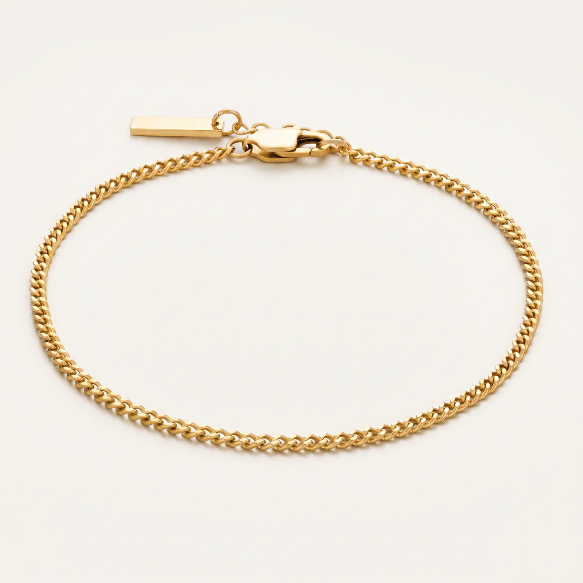 Gold 4mm Cuban link bracelet on white