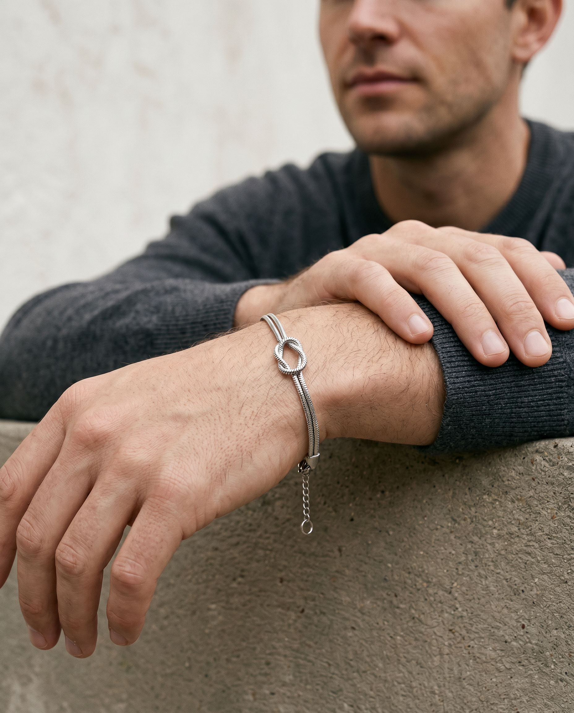 Silver knot bracelet worn on the wrist