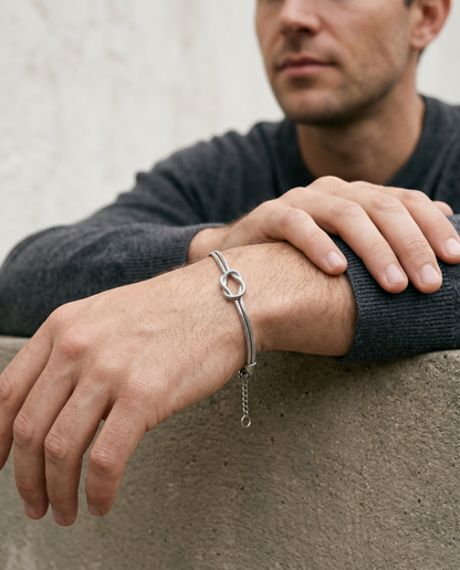 Silver knot bracelet worn on the wrist