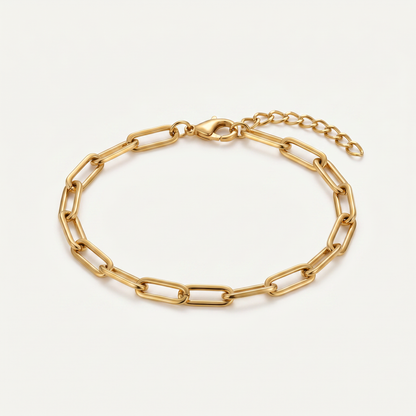 Gold paperclip chain bracelet on white
