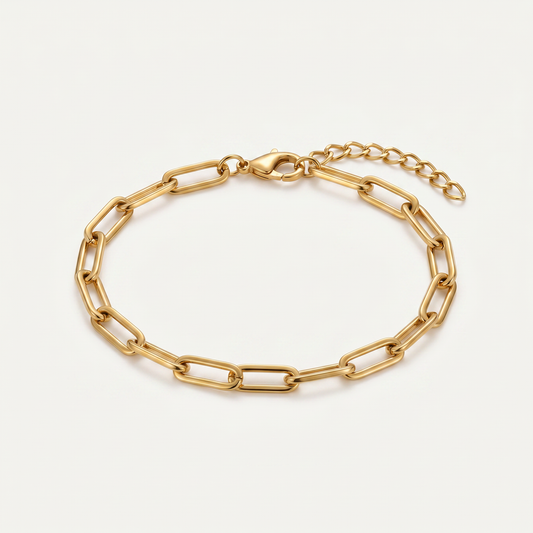 Gold paperclip chain bracelet on white