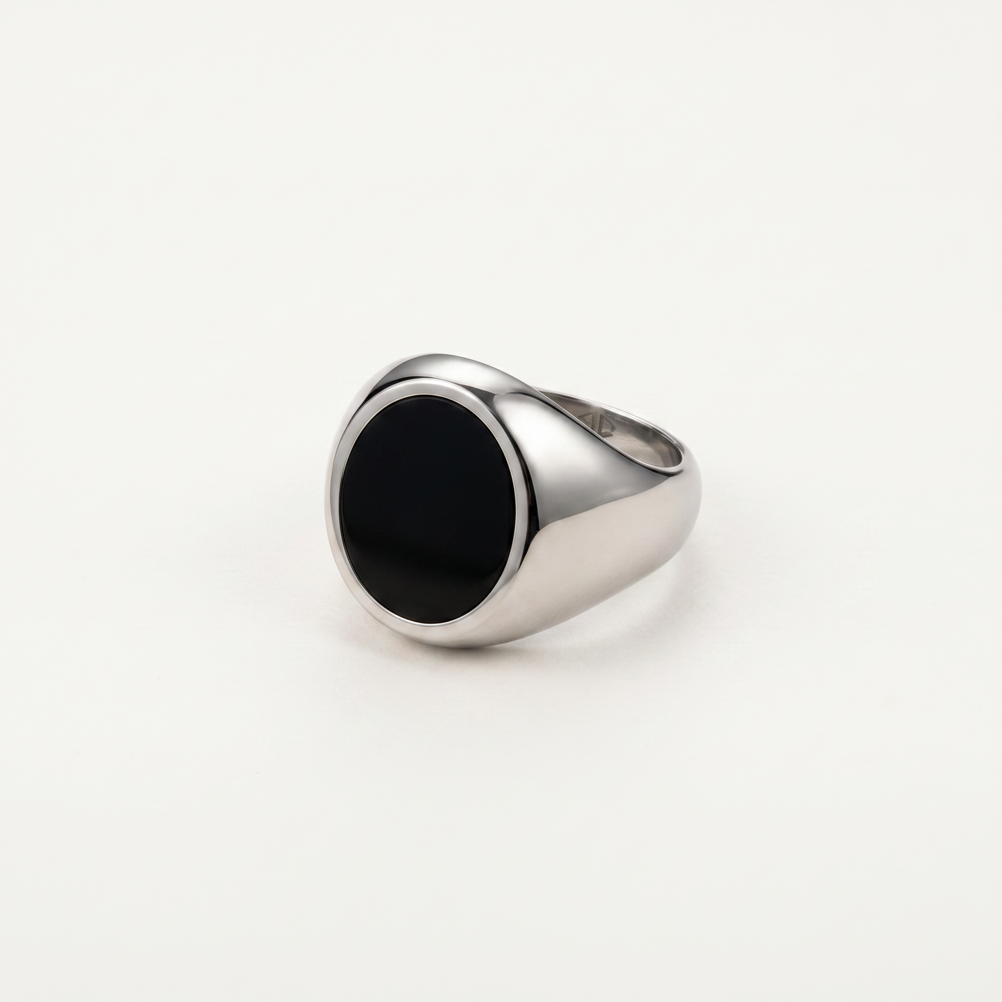 Round onyx signet ring on white