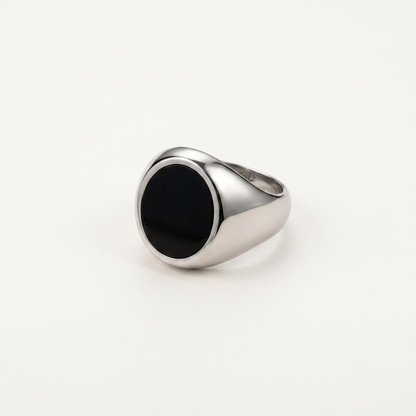 Round onyx signet ring on white