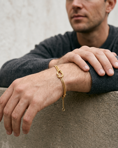 Man wearing the gold knot bracelet