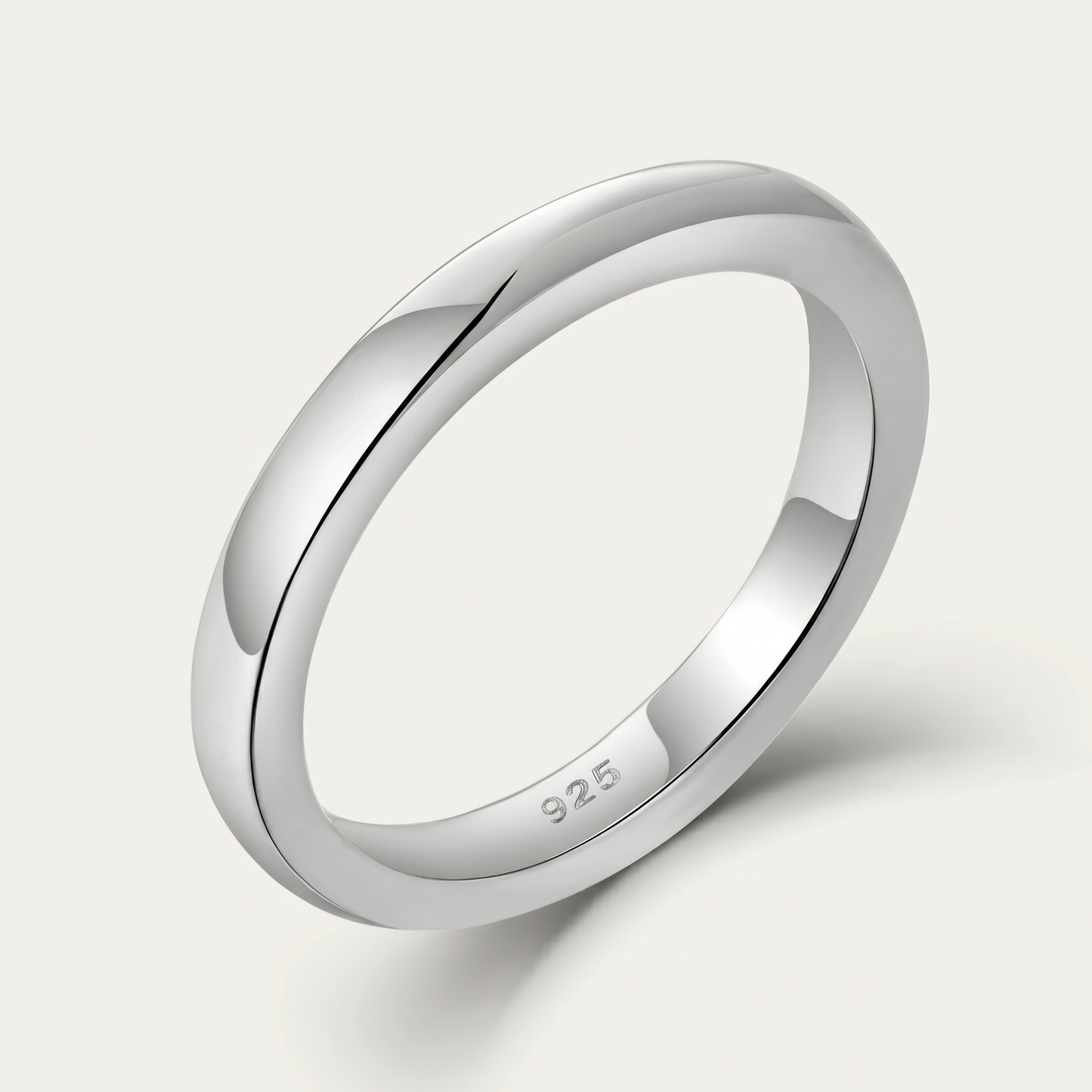 Plain sterling silver band ring on white