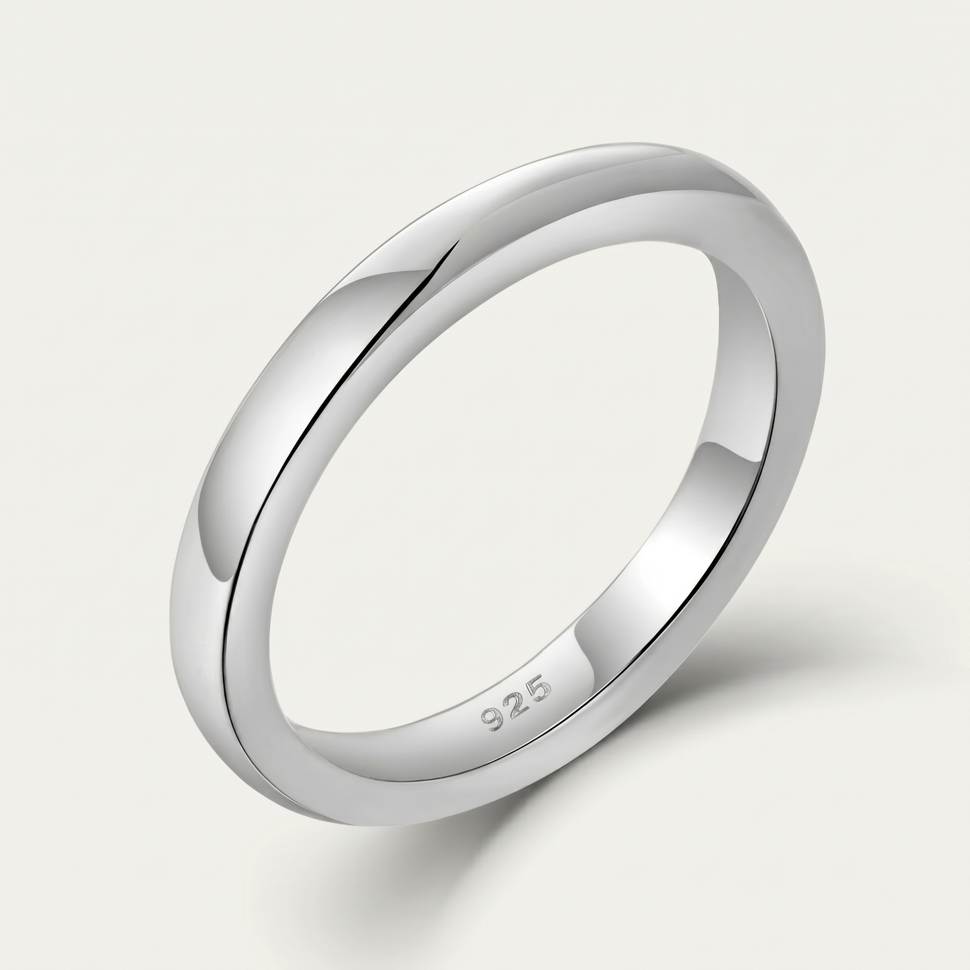 Plain sterling silver band ring on white