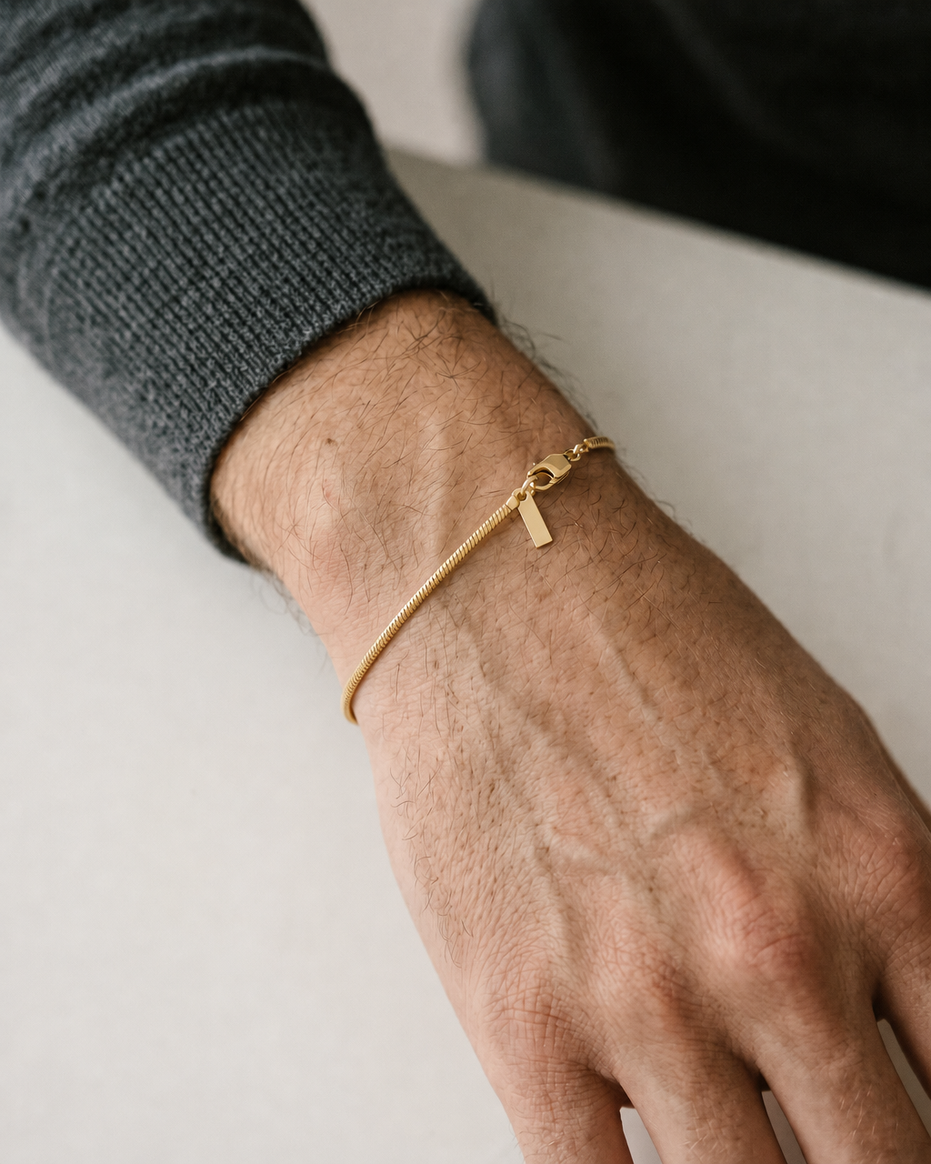 Man wearing the gold classic chain bracelet