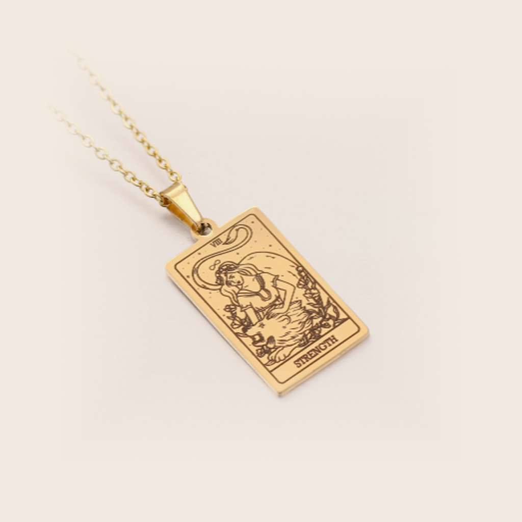 Tarot Necklace Gold, Strength, studio packshot on cream