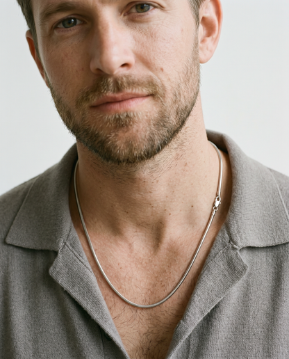 Man wearing the silver chain necklace
